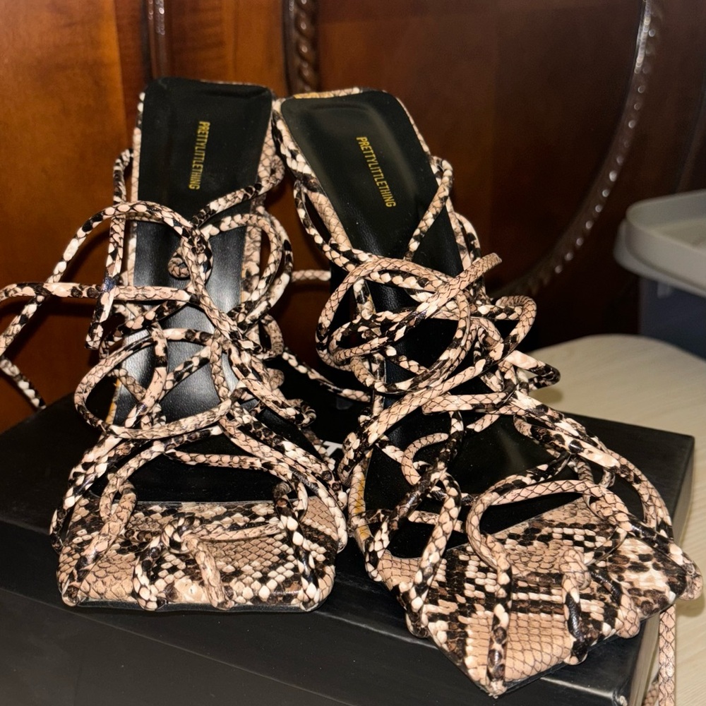 Brown,black and white heels only wore one time. Basically new.